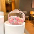 Detailed close-up of pink liquid oil bottle keychain with macaron beads and white snowflakes - Quicksand TV / No Buckle (Pink)