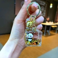 Macro detail of acrylic panda keychain cube with golden glitter stars and purple charms - Lobster Clasp Style / Gold Hardware Cube Black Gold Panda
