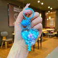 Close-up of blue heart-shaped liquid shaker keychain with cat bell and tiny beads - Blue Snowflake Heart Key / Color Hardware-Blue