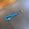 Blauwe siliconen sleutelhanger met kattenpootje en gouden karabijnhaak hanger - Blauw