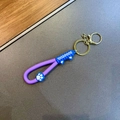 Schattige kattenpoot sleutelhanger met blauwe siliconen oren en paarse band - Paars