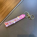 Roze siliconen sleutelhanger met Sunshine Unicorn patronen en gouden metalen sleutelring - Eenhoorn Regenboog Band / Roze