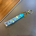 Blauwe siliconen sleutelhanger met regenboog, wolk en gouden karabijnsluiting voor tas - Eenhoorn Regenboog Band / Blauw