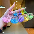 Detailed view of colorful shell-shaped acrylic liquid quicksand keychains in five bright colors - Mixed Colors Shell With Matching Hardware