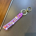 Paarse siliconen sleutelhanger riem met Sunshine Unicorn print en gouden metalen sluiting - Eenhoorn Regenboog Band / Paars