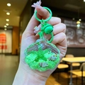 Detail of green acrylic seashell keychain with liquid sand, starfish, and sequin filling - Green Shell With Matching Hardware