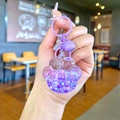 Dettaglio portachiavi a zampa di gatto viola con glitter liquidi e campanellino - Stile Chiusura a Moschettone / Viola