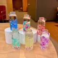 Porte-clés bouteille en verre avec perles lumineuses bicolores en plusieurs coloris - Grand Vase Mince