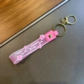 Pink translucent silicone flower keychain wristlet with Happy Moments lettering and gold ring - Pink