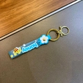 Portachiavi in silicone blu Honey con fiori bianchi e moschettone dorato lucido - Blu