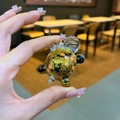 Turtle keychain with floating gold glitter and maple leaf inside a transparent shell - Small Glow Flash Turtle / 1 Piece / Black
