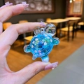 Blue turtle liquid keychain with pink glitter and cherry blossoms in acrylic shell - Small Glow Flash Turtle / Blue