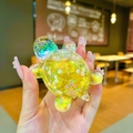 Yellow liquid glitter turtle figurine with cherry blossom sequins and blue-green head - Large Luminous Glitter Turtle / 1 Piece / Yellow