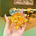 Turtle shaped liquid quicksand toy in transparent acrylic with golden glitter petals - Large Luminous Glitter Turtle / 1 Piece / Orange