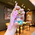 Portachiavi coniglio Sakura luminoso con sabbie mobili e cinturino in silicone rosa - Stile Portachiavi con Cinturino in Pelle / Perle a Bolle Luminose Tata (Colorato)