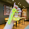 Detail of yellow acrylic shaker keychain with cartoon resin figure and Sakura strap - Leather Strap Keychain Style / Luminous Bubble Beads Tata (Yellow)