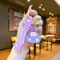 Detailed macro view of purple resin rabbit keychain with Sakura silicone wrist strap - Leather Strap Keychain Style / Luminous Bubble Beads Tata (Purple)