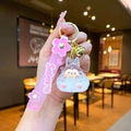Detail of pink sakura bunny keychain with golden bell and silicone hand strap - Leather Strap Keychain Style / Luminous Bubble Beads Tata (White)