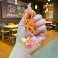 Détail d'un porte-clés patte de chat avec paillettes scintillantes et perles colorées - Style Mousqueton / Orange (Mini Patte de Chat Flocon)