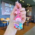 Detailed view of a pink luminous pig keychain with liquid oil and heart-shaped carabiner - Dazzle Color (Night Glow Peach Pig)