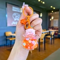 Porte-clés cochon lumineux avec liquide orange, mascotte rose et clochette en métal - Style Matériel Coloré / Orange