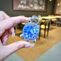 Detail of a resin turtle charm filled with blue beads and sequins, shown in hand - Blue Luminous Bubble Bead Turtle