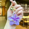 Purple star-shaped acrylic ocean quicksand keychain with seashells and golden lobster clasp - Purple Star With Golden Hardware