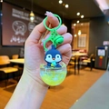 Cute penguin liquid sand keychain with green bell and yellow oil inside clear egg shell - Green Penguin (Colorful Hardware)