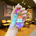 Detailed close-up of a cartoon deer keychain with glitter liquid ball and purple strap - Purple Deer