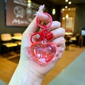 Luminous red heart wing keychain with glitter flow bottle and matching bell charm - Lobster Clasp Style / Red