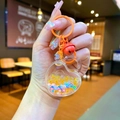 Acryl Herz-Treibsand Schlüsselanhänger mit gelben Perlen, Pailletten und roter Glocke - Karabiner-Stil / Orange