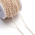 Macro shot of 3mm pink faceted crystal bead chain on white spool for DIY jewelry - 1 Meter/Pack (Approx. 3x3.5mm) Approx. 10g / Gold Cream White