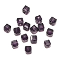 Macro shot of 8mm faceted purple crystal cube beads for DIY jewelry making with central hole - Deep purple