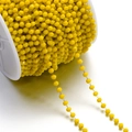 Macro detail of 3mm yellow faceted crystal bead chain on a spool for DIY jewelry making - 1 Meter/Pack (Approx. 3x3.5mm) Approx. 10g / Gold Yellow