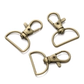 Detail van 25 mm antiek bronzen karabijnsluitingen met D-ring voor DIY-sieraden maken - 5 Stuks Per Pak / Brons