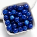 Macro detail of dark blue mermaid resin beads with starry glitter effect for DIY jewelry - Dark Blue / 8mm