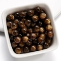 Macro view of 6/8mm resin cat eye beads with golden sheen in a white ceramic bowl - 8mm / Brown