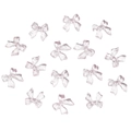 Macro view of light purple translucent resin bow accessories for DIY nail art and crafts - Pink