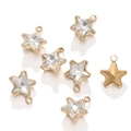 Macro detail of 18k gold plated star charms with faceted zircon stones and hanging loops - Gold Base White