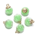Close-up of 6 glass globe pendants with light green micro beads and golden metal caps - 5 Pcs/Pack / Round-Green