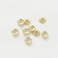 Detailed macro view of 18k gold plated flower bead caps with hollow filigree for DIY jewelry - 7mm / 14K Gold