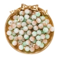 Detail of 10mm ice-cracked glass beads with green and brown tones in a gold tray - Orange Green