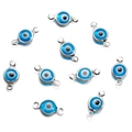 Macro shot of 10 blue evil eye connectors with silver frames for DIY jewelry making - Double Bail / 10 Pieces Pack / Steel Blue
