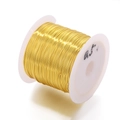 Detailed close-up of 0.5mm golden tarnish resistant copper wire on a white spool for DIY - 0.5mm (Approx. 10m/Bag) / Gold