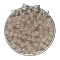 Macro shot of 8x7mm candy-colored glass apple beads in a vintage silver tray - Brown