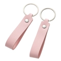 Detail of pink faux leather keychains with lychee texture and silver metal rings - Pink Lychee Fold