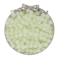 Macro view of light green glass apple beads on a silver tray for DIY jewelry making - Light Yellow