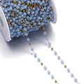 Macro view of blue cat eye glass beads and gold stainless steel chain on a white spool - 1 Meter / Non-Coiled (Bead Diameter Approx 4.5mm) / Gold Sky Blue