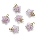 Detail of star-shaped glass charms with purple glitter and golden metal loops - Purple