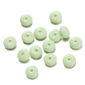 Close-up of translucent light green glass abacus beads for DIY jewelry making with 1.5mm hole - 1 String/Pack (4.5x8mm/Hole 1.5mm) / Solid Light Green